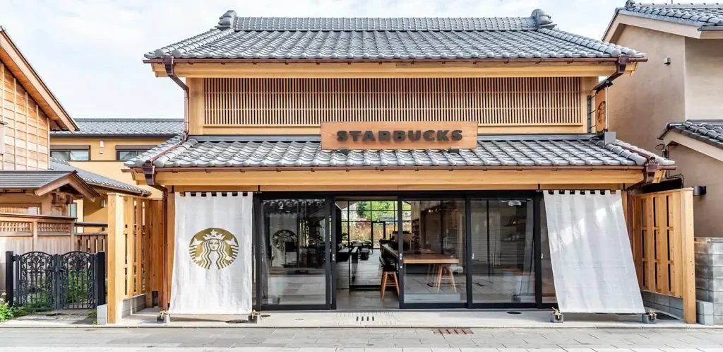 A Starbucks barista records a TikTok video inside a coffee shop, illustrating the rise of employee-generated content and the workplace creator economy.